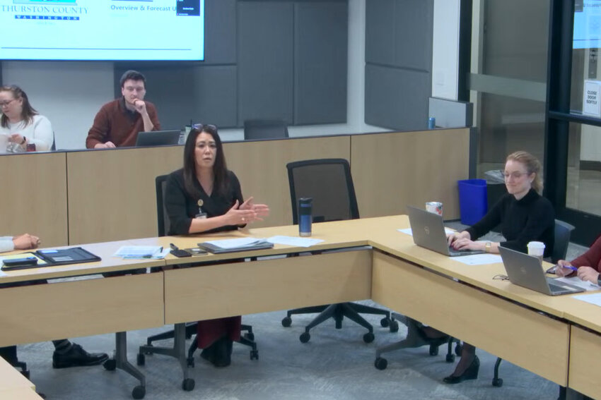 Thurston County Budget and Finances Manager Summer Miller, left center, presents a quarterly budget update during a Board of County Commissioners work session on Feb. 26.