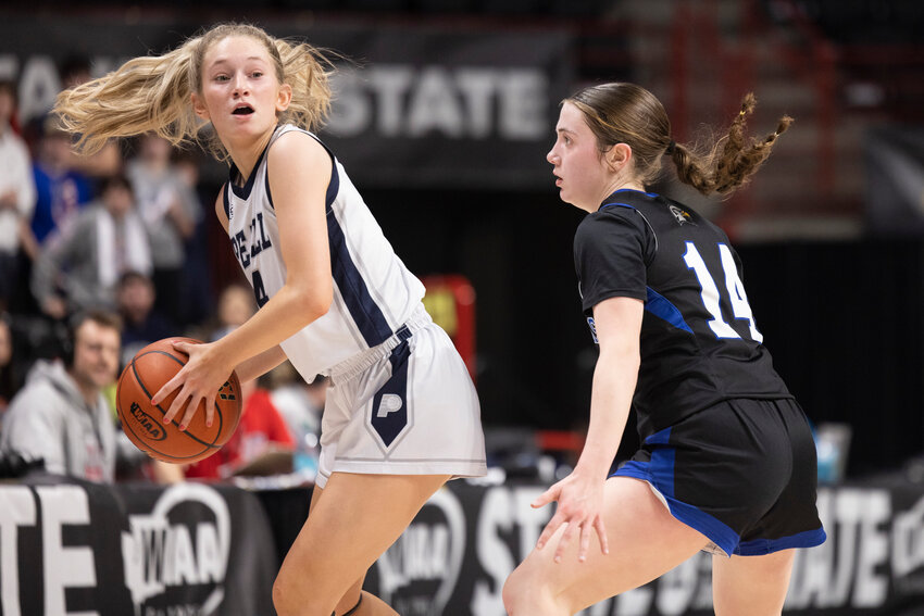 Pe Ell's Karli Phelps (4) looks to pass the ball during a 2B Girls State Tournament Round of 12 game against Oakesdale at the Spokane Arena on Wednesday, March 5.