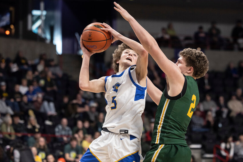 Adna&rsquo;s Trevin Salme (5) attempts to shoot the ball during a 2B Boys State Tournament Round of 12 game against Liberty Bell at the Spokane Arena on Wednesday, March 5.