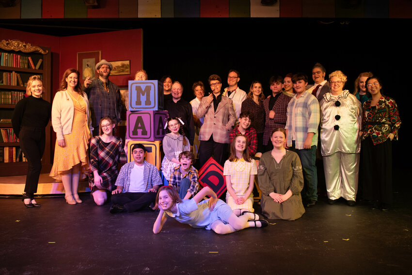 The cast of &ldquo;Matilda&rdquo; poses for a photo ahead of a dress rehearsal at the Evergreen Playhouse in Centralia on Tuesday, March 4.
