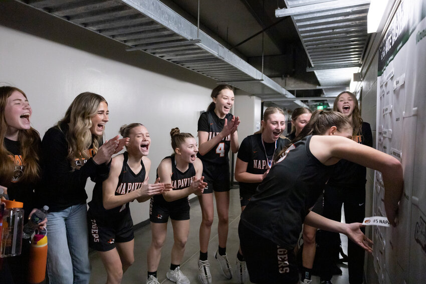 Napavine players celebrate advancing to the semifinals after winning the 2B Girls State Tournament Quarterfinal against Brewster at the Spokane Arena on Thursday, March 6.