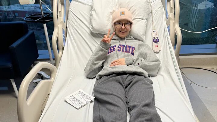Hunter Wilson holds up a peace sign while undergoing medical treatment in this photo from the GoFundMe.com crowdfunding website.