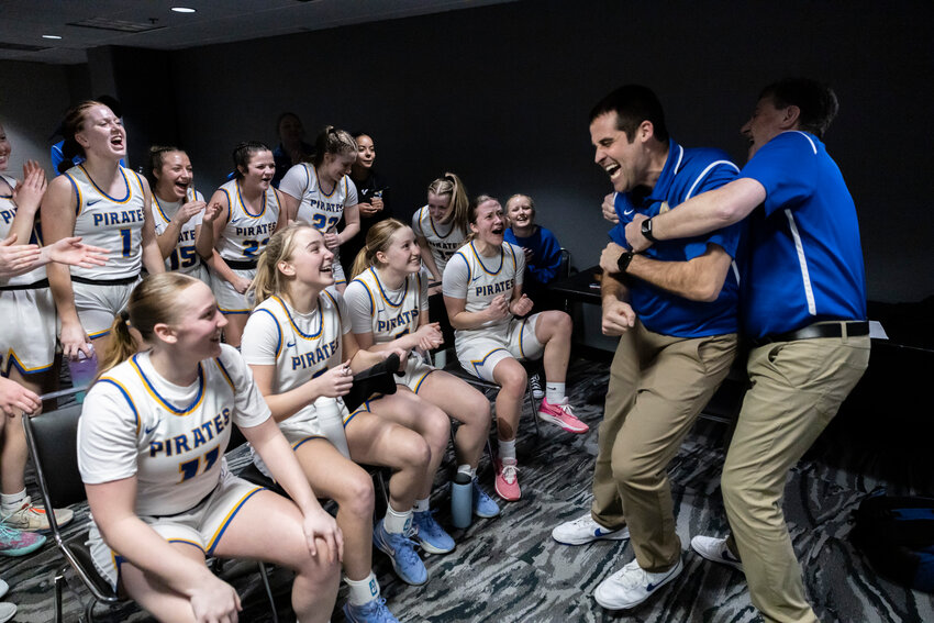 Adna assistant coach Mike Marte embraces head coach Chris Bannish to celebrate winning the 2B Girls State Tournament Semifinal game against Napavine at the Spokane Arena on Friday, March 7.