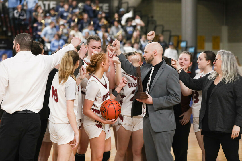 The W.F. West Bearcats break it down with the sixth-place trophy after placing sixth in the 2A State Tournament at the Yakima SunDome on March 8.