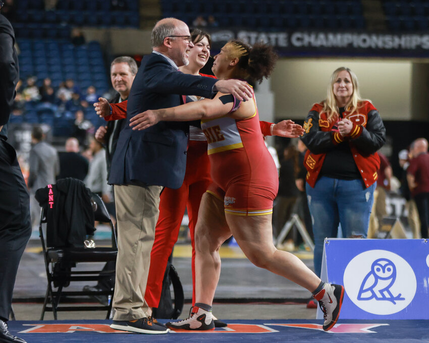 Prairie High School wrestling head coach Rob Smith was named the 3A Greater St. Helens League coach of the year while four-time state champion Faith Tarrant earned a first team all-league honor.