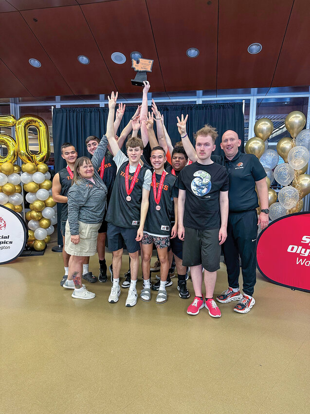 The Battle Ground High School Unified Basketball Team celebrates after earning third place at the state competition in Wenatchee from Friday, Feb. 28, through Saturday, March 1.