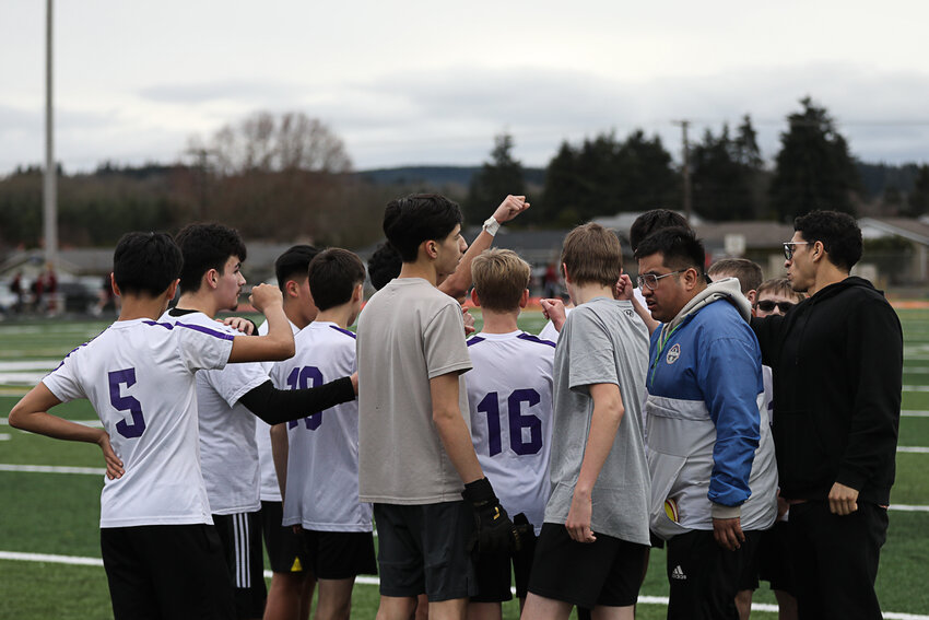 The Onalaska Loggers break down a team huddle during a jamboree at Tiger Stadium on March 10.