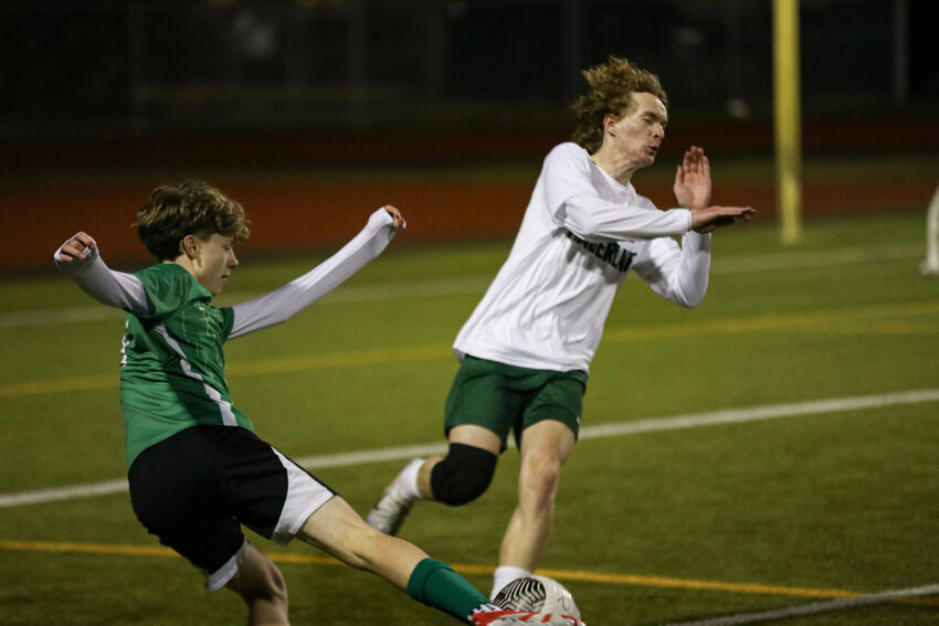 Tumwater's William Thomas (left) kicks the ball against Timberline in a non-league match on Thursday, March 13 at Tumwater District Stadium.