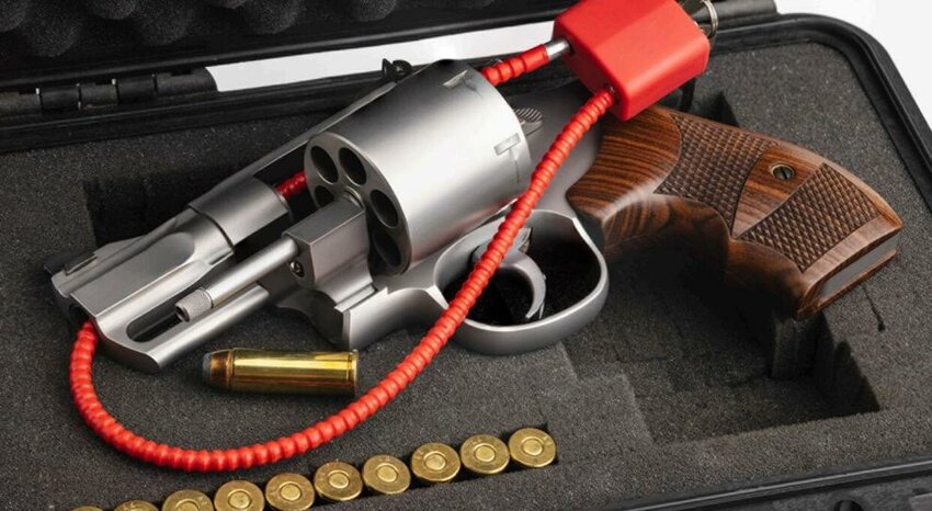 A revolver secured with a gun lock.