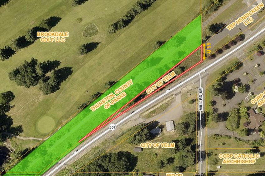 The Thurston County Board of Commissioners is considering transferring ownership of a parcel along the Yelm-Rainier-Tenino Trail to the City of Yelm for parking development. The green represents county-owned property while the red represents city-owned land.