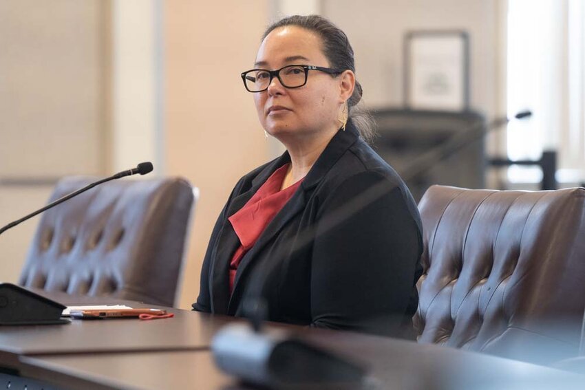 Lewis County Public Health Director Meja Handlen watches a presentation during a Lewis County commissioners meeting at the Lewis County Courthouse in Chehalis on Tuesday, March 18.