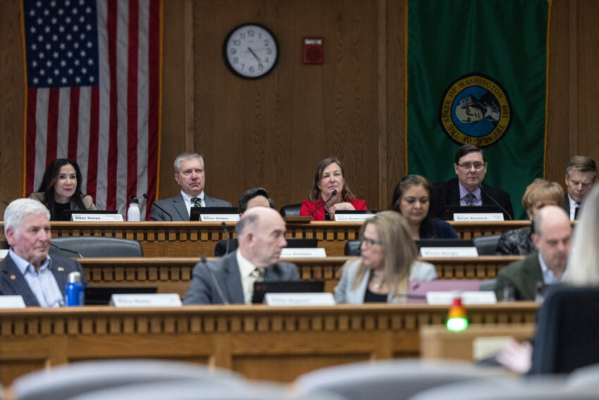 Senators listen to public comment during a hearing on Senate Bill 5400 in the John A. Cherberg Building in Olympia on Tuesday, March 18.