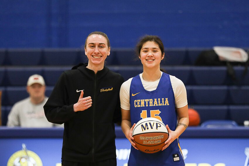 Rainier's Angelica Askey is awarded the MVP commemorative ball after the Southwest Washington Senior All-Star Game at Centralia College on March 23.