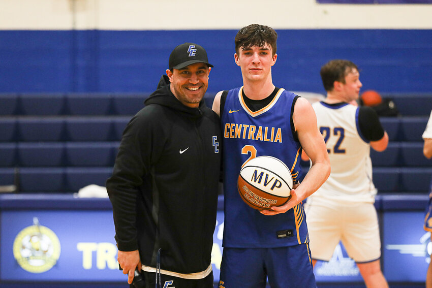 Napavine's Karsen Denault is awarded the MVP commemorative ball after the Southwest Washington Senior All-Star Game at Centralia College on March 23.