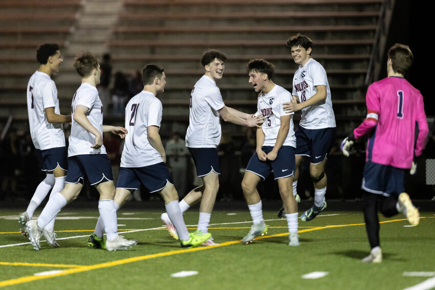 Black Hills players celebrate defeating Centralia after going into overtime at Centralia High School on Tuesday, March 25.