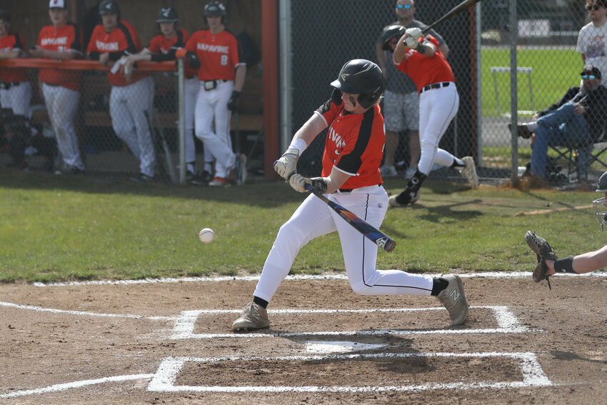 Napavine's Beckett Landram hits a base hit up the middle during Napavine's win over Toutle Lake on March 26.