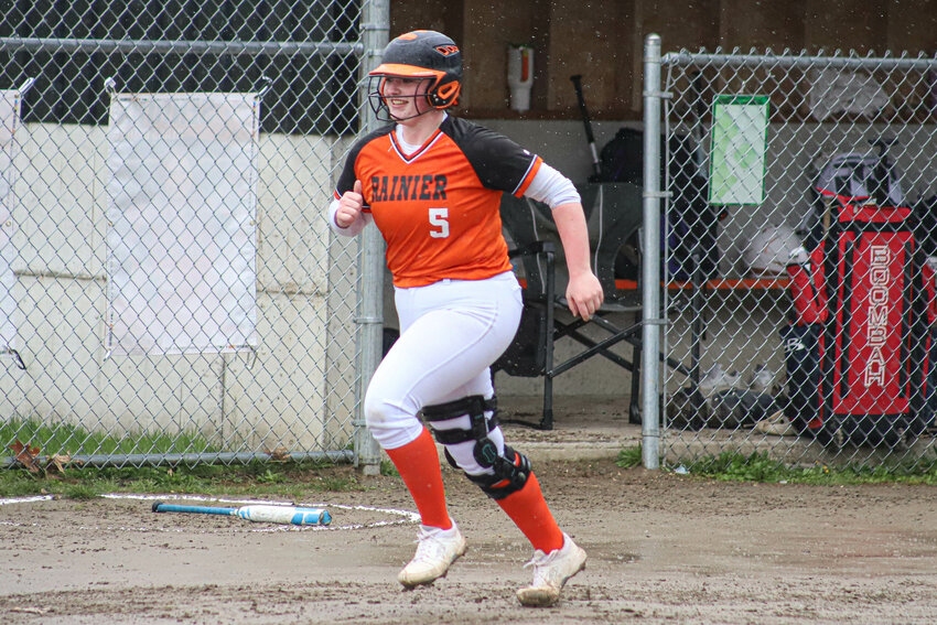 Rainier's Ryleigh Cruse (5) rounds the bases after a three-run home run against Mossyrock at Rainier Elementary School on Monday, March 31.