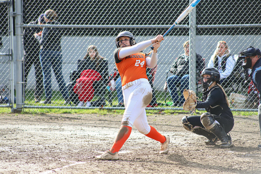 Rainier's Keira Anderson (24) swings at a pitch against Mossyrock at Rainier Elementary School on Monday, March 31.