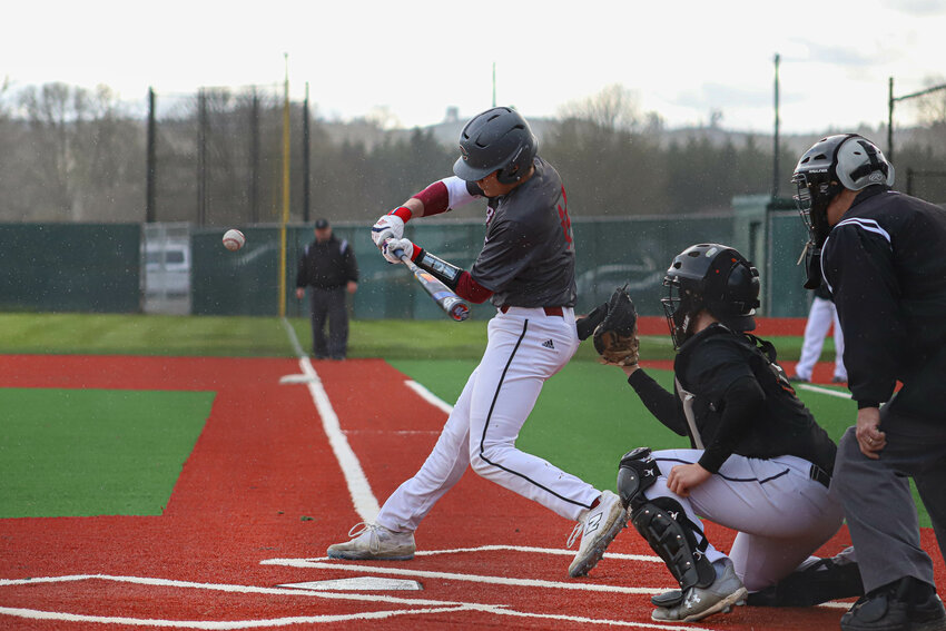 W.F. West's Hudson McCallum (14) swings against Centralia at Fort Borst Park on Tuesday, April 1.