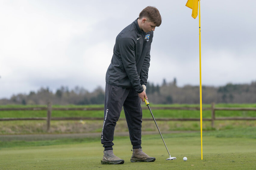 Adna&rsquo;s Alex Smith attempts a putt during a match at Riverside Golf Course in Chehalis on Wednesday, April 2.
