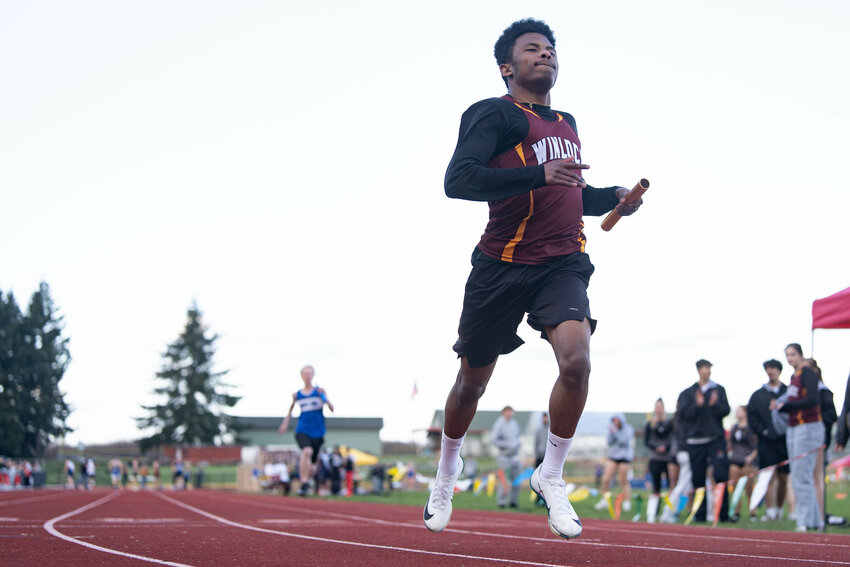 Winlock's Xavier Sancho-Carrillo runs the 4x100 meter relay during a track and field meet at Winlock High School on Thursday, April 3.