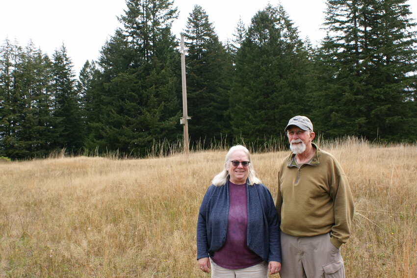 Dennis Plank and Gail Trotter stand on the Glacial Heritage Preserve.