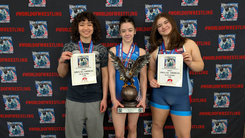 From left to right, Thurston County Wrestling Club's Nancy Nguyen, Sloane Kruger, and Isabella Chenard pose for a photo after competing in the Reno Worlds Wrestling Tournament in Reno, Nevada.