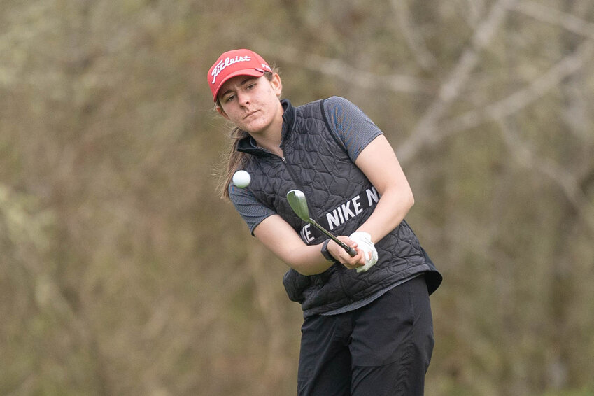 Black Hills&rsquo; Ellie Johnson hits a chip shot during a golf match against Tumwater at Tumwater Valley Golf Course on Wednesday April 9.