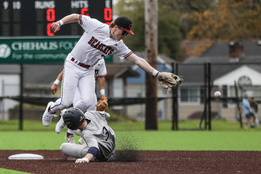 W.F. West&rsquo;s Ross Kelley reaches for the ball at second base during a baseball game against Bainbridge at W.F. West High School on Thursday, April 10.
