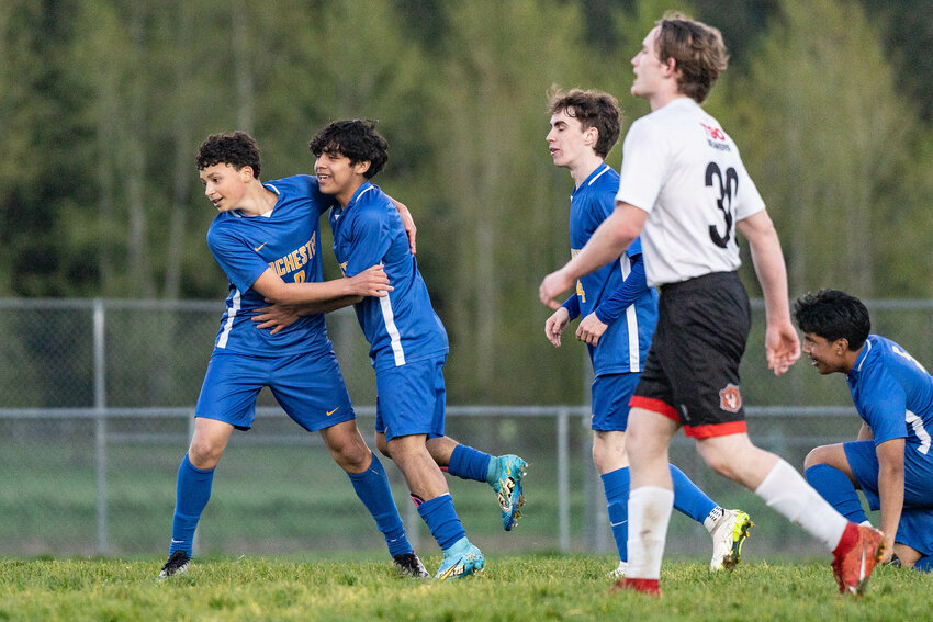 Rochester players celebrate a goal during a win over Tenino on Thursday, April 10.