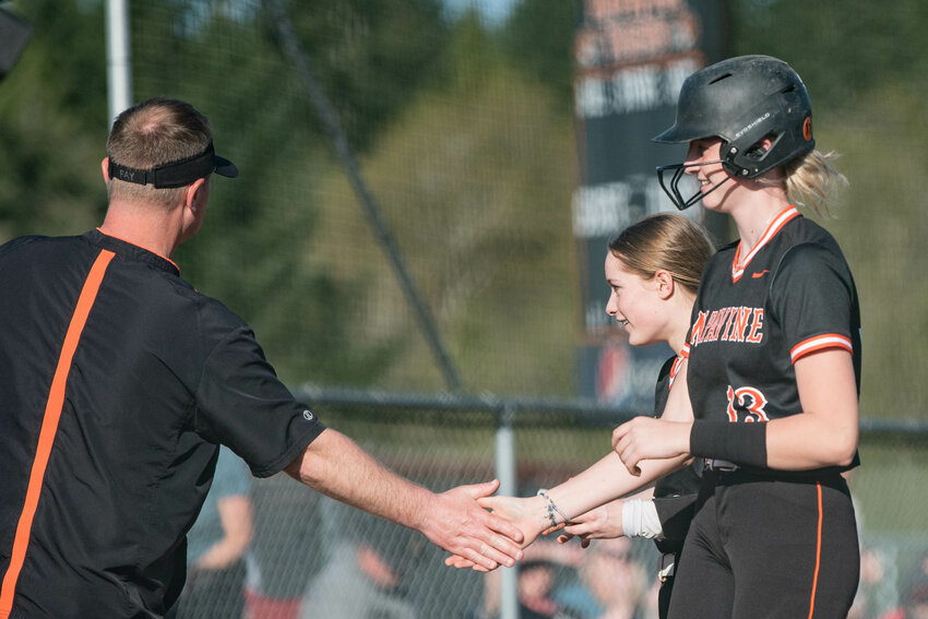 Napavine&rsquo;s Hayden Kaut high fives coach Josh Fay after hitting a walk-off single during a win over Onalaska at Napavine High School on Monday, April 14.