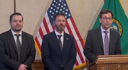 From left, Rep. Travis Couture, R-Allyn, Rep. Dan Griffey, R-Allyn, and Gov. Bob Ferguson at the bill signing on April 11.