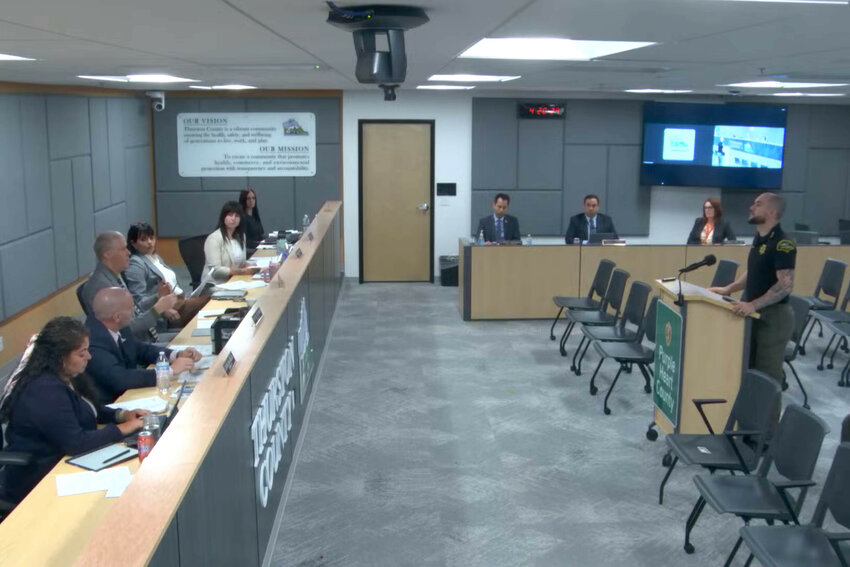 Thurston County Sheriff Derek Sanders presents information on multiple agenda items to the Board of Thurston County Commissioners at The Atrium on Tuesday, April 15.