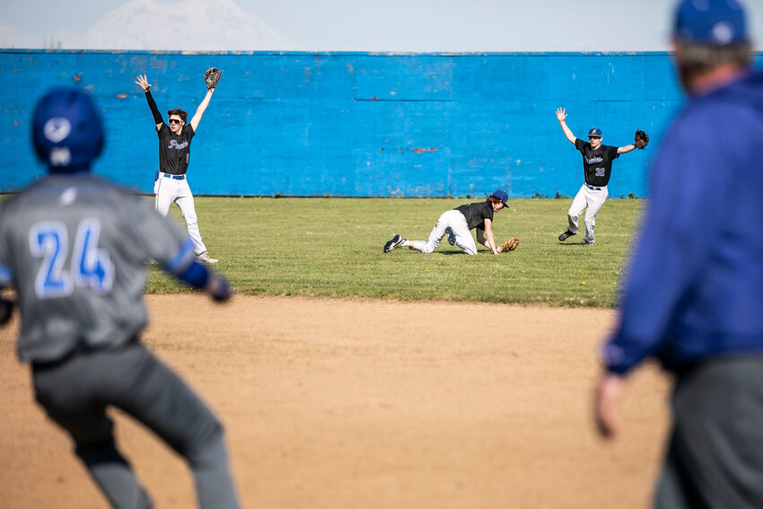 Adna&rsquo;s Cash Smith (8) and Bryce Pine (32) celebrate a catch made by Mat Roundtree (5) during a baseball game against Toutle Lake at Adna High School on Wednesday, April 16.
