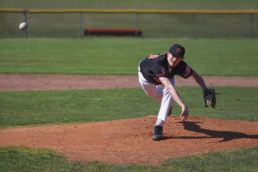 Rainier's Peyton Sheaffer (23) throws a pitch against Toledo at Toledo High School on Wednesday, April 16.