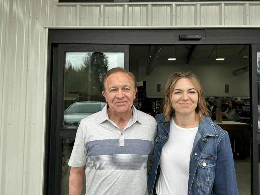 Greg Drew, left, stands with his daughter Julie Cox in front of the new Drew's Grocery in Toutle.  The family business reopened its doors Wednesday after rebuilding from a March 2022 fire.