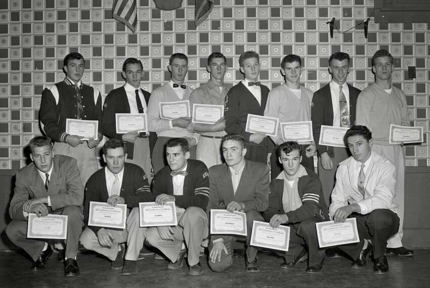 FROM THE ARCHIVES: "Lewis County Defensive All-Stars are pictured above with the certificates they were awarded at the annual Daily Chronicle all-star football banquet held Saturday at noon at St. Helens Hotel in Chehalis. Team members pictured are, front row, from left, Jim Elliott, Pe Ell, Quarterback; Alan McGee, Onalaska, guard; Jerry Nehring, Onalaska, halfback: Richard Moeman, Mossyrock, center; Sherm Porter, Winlock, fullback; and Leo Girosky, Pe Ell, guard. In the back row are, from left, Don Derkacht, Onalaska, end; Leonard Birdwell, Onalaska, tackle; John Raupp, Toledo, tackle; Roland Wallace, Toledo, end; Jim Mann, Winlock, guard; Don Bond, Toledo, halfback; Wally Bowers, Winlock, end, and Cecil Knutsen Toledo, halfback." — originally published by The Daily Chronicle on Dec. 12, 1955