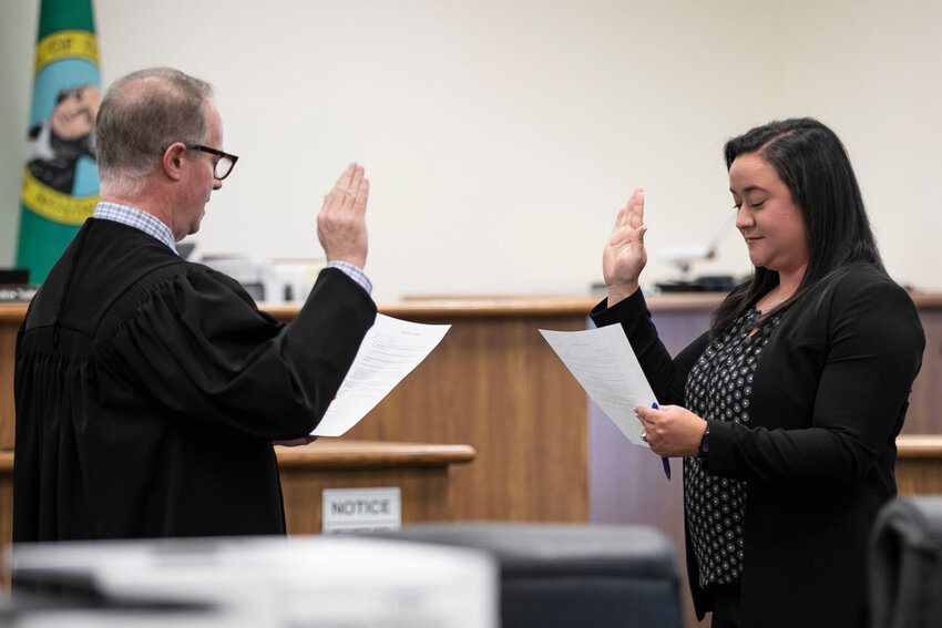Brooke Bassetti is sworn in by Judge J. Andrew Toynbee to join the JBJ Law Group as an attorney in courtroom 1 at the Lewis County Superior Court in Chehalis on Friday, April 18.