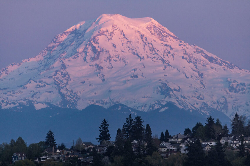 Mount Rainier is pictured from downtown Tacoma as the sun sets on Thursday, April 18.