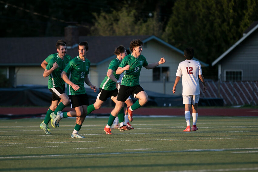 Tumwater's Grady Harroun (18) celebrates a goal with teammates during a soccer game at Tumwater High School on Friday, April 18.