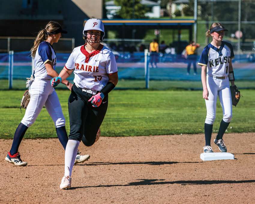 Prairie&rsquo;s Payton Blunt rounds second base with a smile after a first-inning home run in the Falcons&rsquo; 3-2 loss to Kelso High School on Tuesday, April 15.