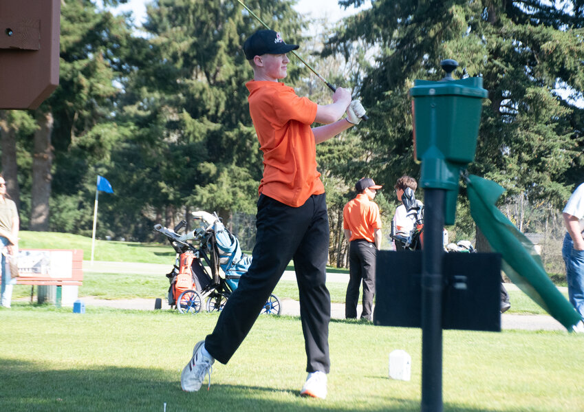 Elliott Drake checks out his drive at the Tahoma Valley Golf Course on Wednesday, April 16.