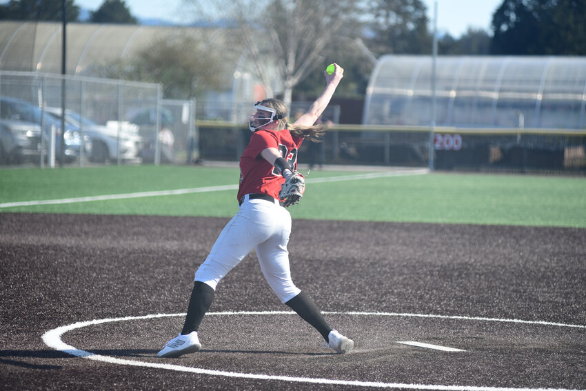 Senior pitcher Kylie Minker smiles as she crosses home plate, following a solo-shot to tie Yelm's contest with Peninsula at six a piece on Friday, April 18.