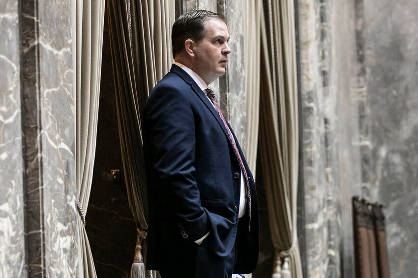 Sen. John Braun, R-Centralia, stands in the wings of the Senate floor at the Washington state Capitol in Olympia on Friday, April 25.