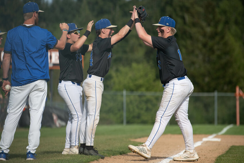 Adna players celebrate during a win over Napavine on Friday, April 25.