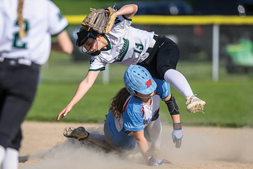 Mark Morris baserunner Shyanne Sellers upends Woodland&rsquo;s Emma Barrow after a hard slide during a 2A GSHL contest on Wednesday, April 23, at 7th Ave. Park. The Monarchs went on to 15-0.