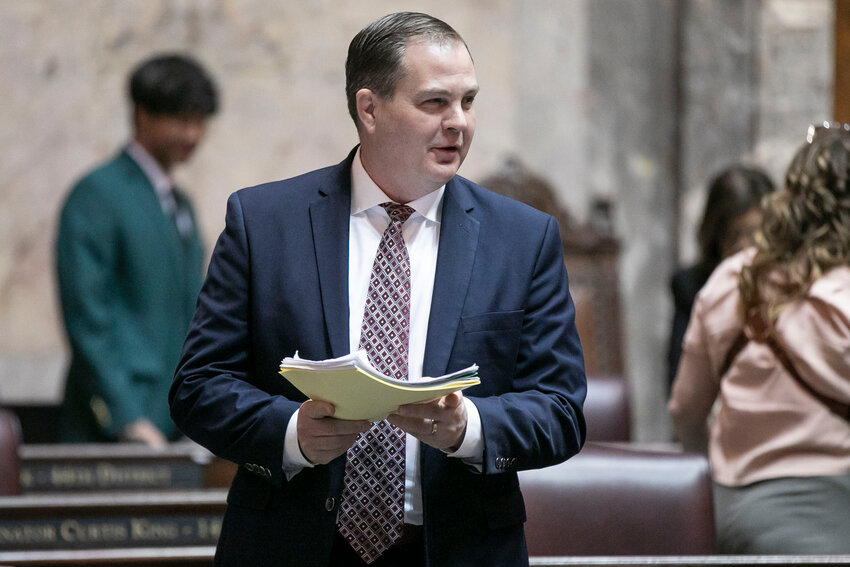 Sen. John Braun, R-Centralia, speaks with other senators  during the legislative session at the Washington state Capitol in Olympia on Friday, April 25.
