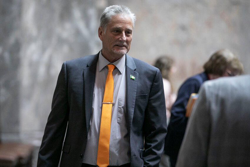 Sen. Jeff Wilson, R-Longview, speaks with other senators  during the legislative session at the Washington state Capitol in Olympia on Friday, April 25.