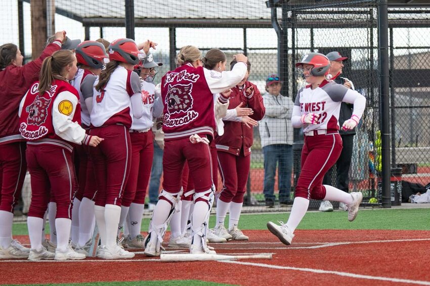 W.F. West&rsquo;s Avalon Myers meets her team at home plate after hitting a home run during a win over Black Hills in Chehalis on Tuesday, April 29.