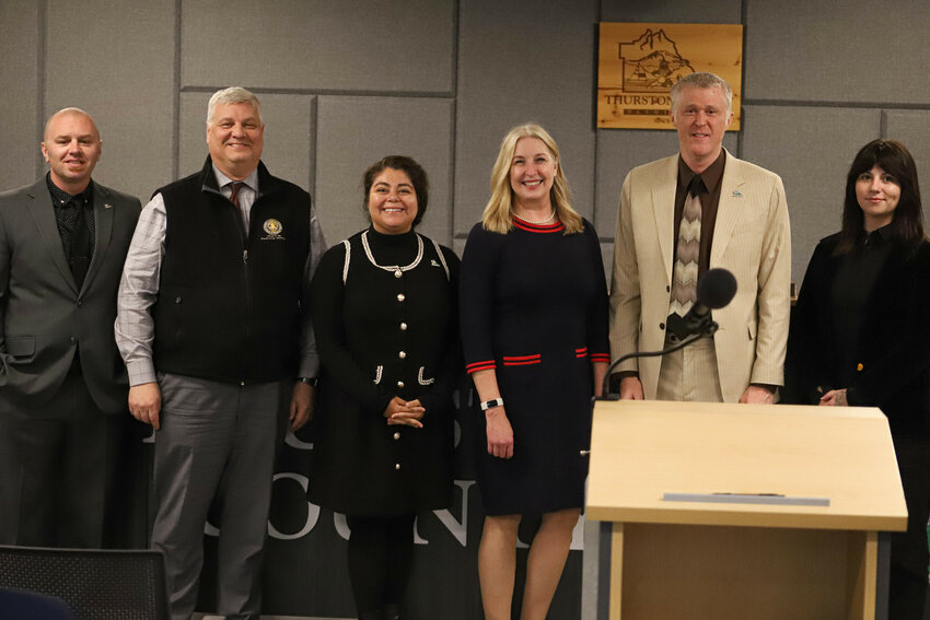 From left: Thurston County Commissioner Wayne Fournier, Prosecuting Attorney Jon Tunheim, Commissioner Carolina Mejia, Prosecuting Attorney's Office Chief of Staff Christy Peters, Chair Tye Menser, and Commissioner Emily Clouse pose for a photo at the Tuesday, April 29, Board of County Commissioners meeting at The Atrium.